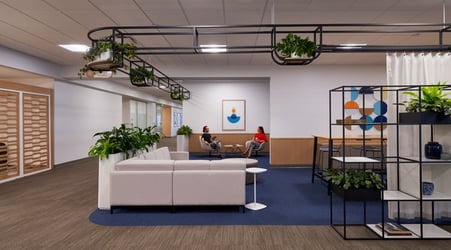 Employees sitting and talking in an office